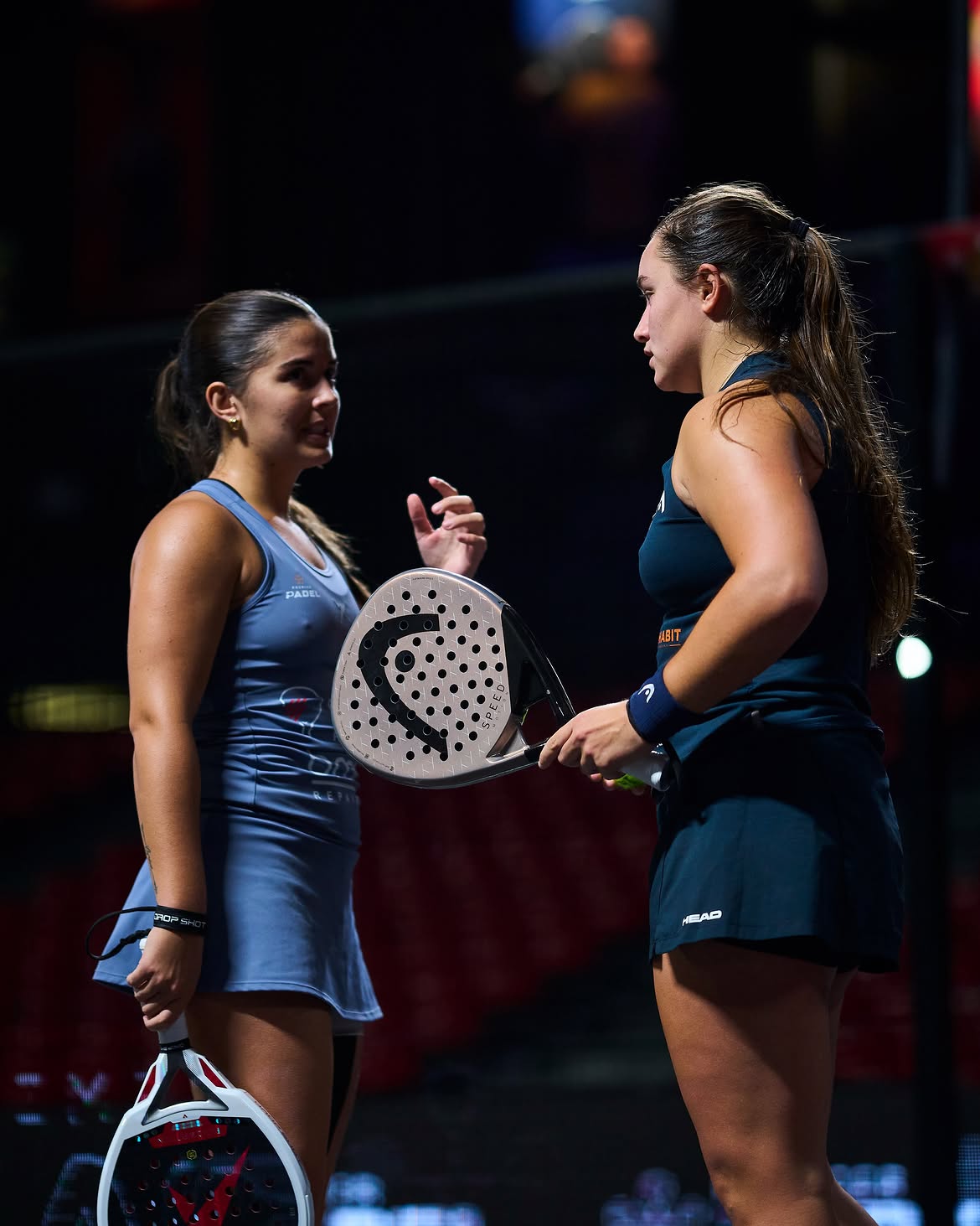 Two players talk tactics between points